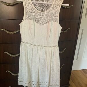 Light cream Guess size 6 lace dress.  Great for any occasion.